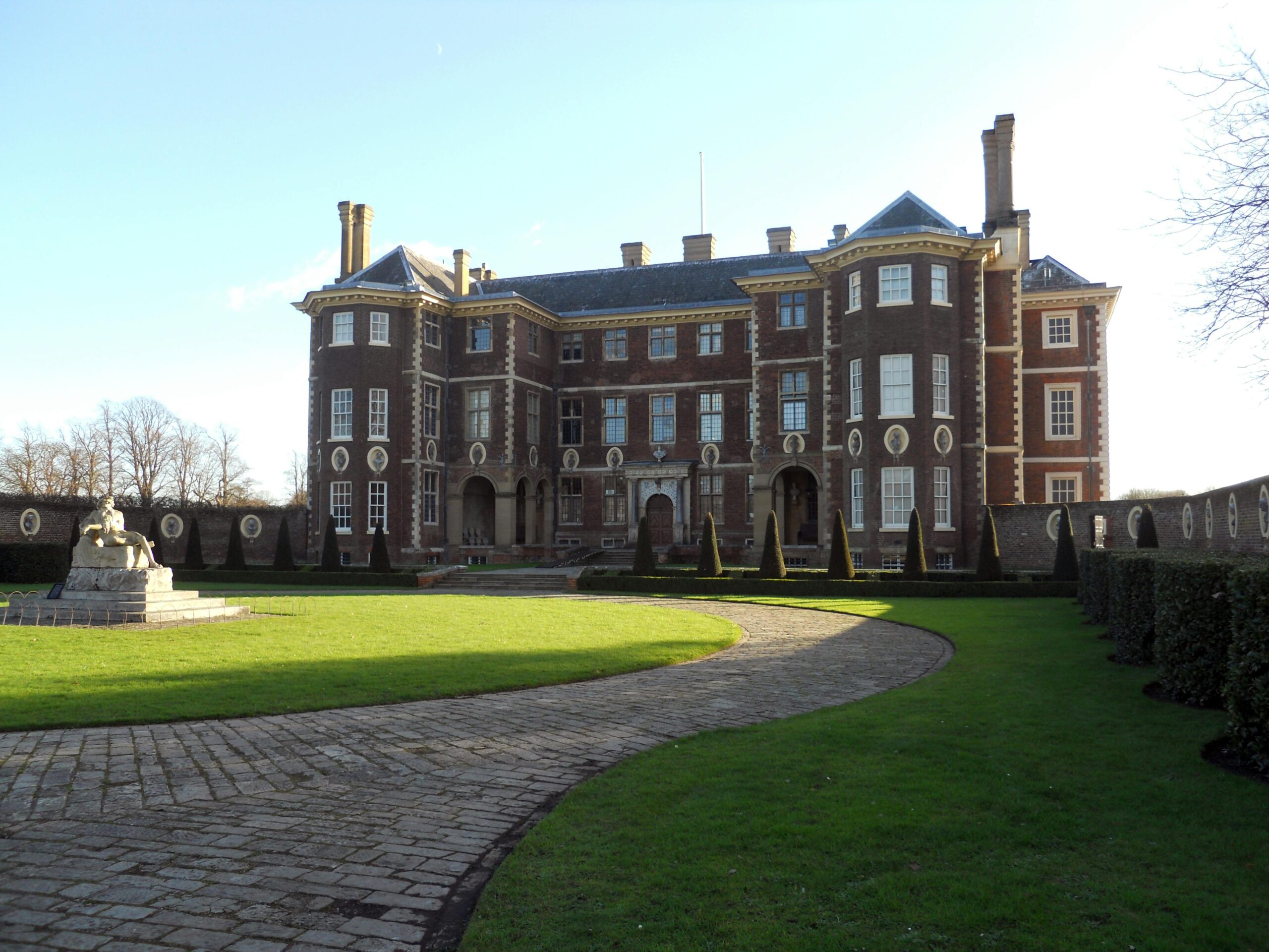 View of the historic Ham House in Surrey, England, with a manicured courtyard.