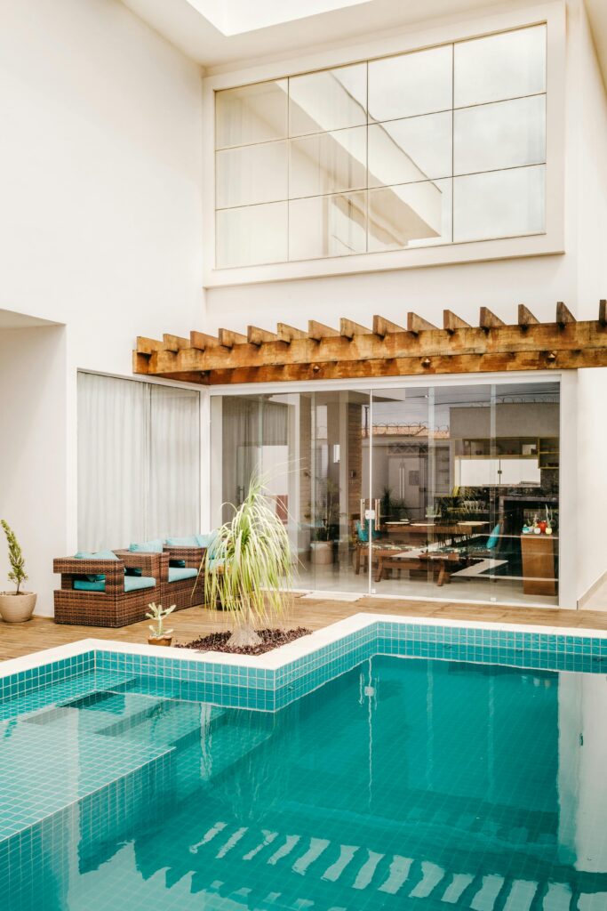 Ventes Stylish modern villa featuring an outdoor pool and cozy patio area.